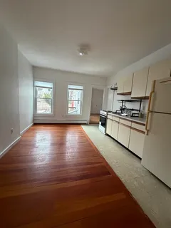 a kitchen with kitchen island a counter top space and stainless steel appliances