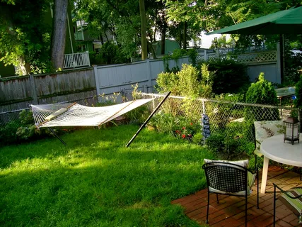 a view of a table and chairs in the garden