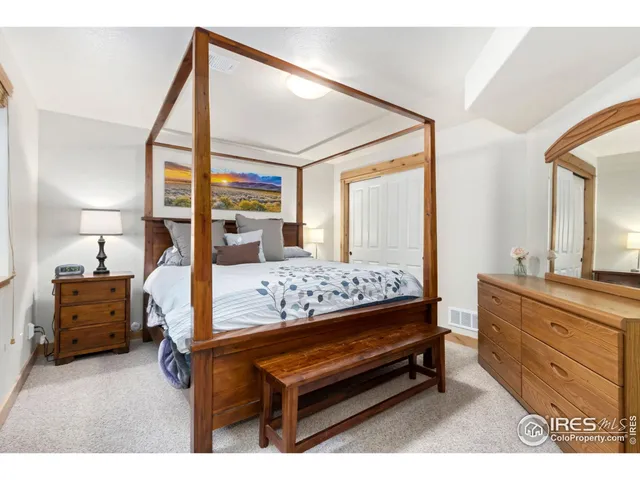 a bedroom with furniture and a dresser