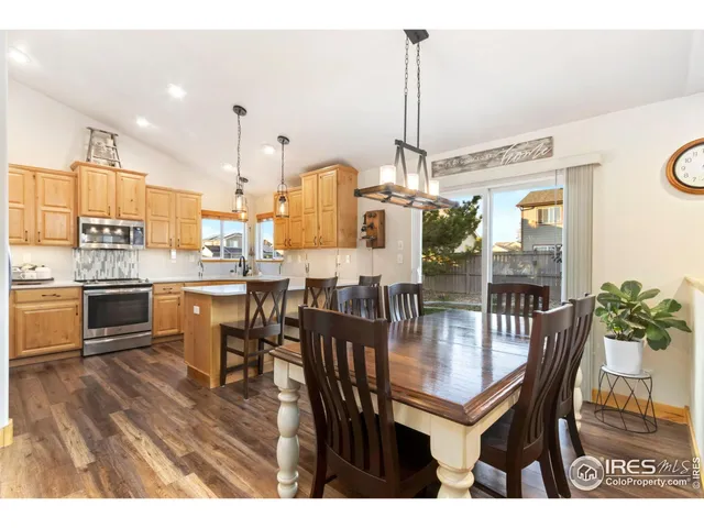a dining room filled with lots of furniture and chairs