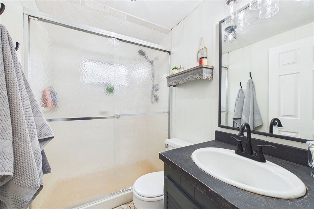 13 Albatross Avenue Wareham, MA 02538 - Photo 19 of 25 a bathroom with a sink toilet and a mirror