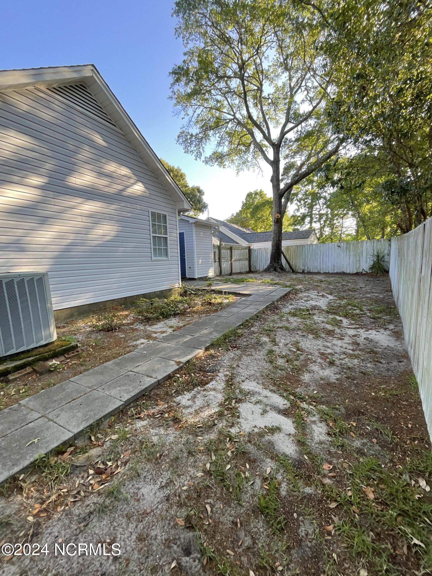 1405 Faulkenberry Road Wilmington, NC 28409 - Photo 14 of 29 Hard wood trees and fenced back yard