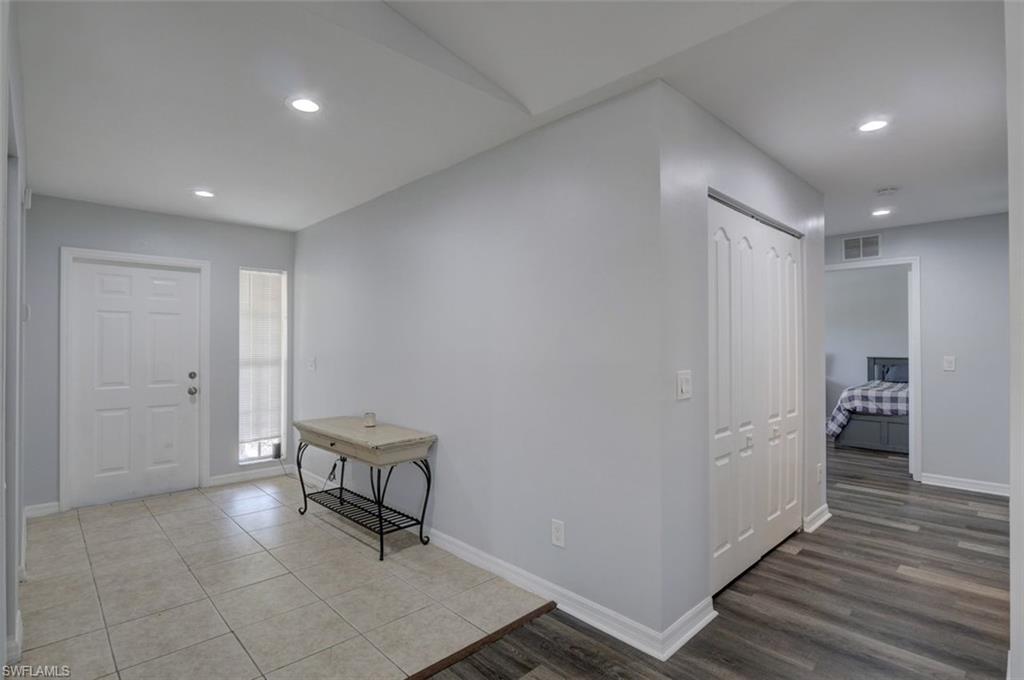 2812 4th Street Southwest Lehigh Acres, FL 33976 - Photo 15 of 34 a view of a hallway with wooden floor