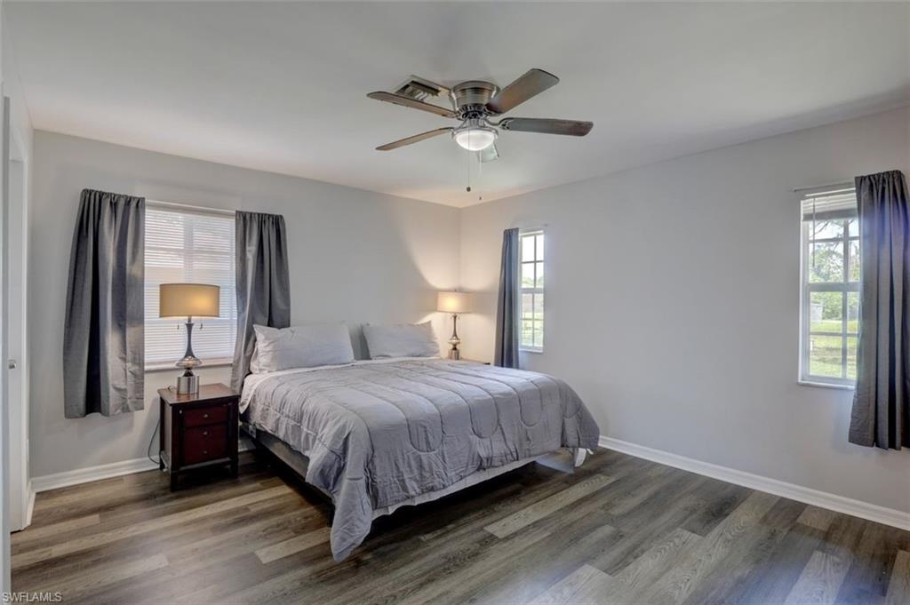 2812 4th Street Southwest Lehigh Acres, FL 33976 - Photo 16 of 34 a bedroom with a bed and window