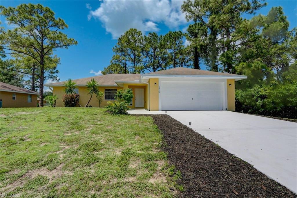 2812 4th Street Southwest Lehigh Acres, FL 33976 - Photo 2 of 34 a view of a backyard