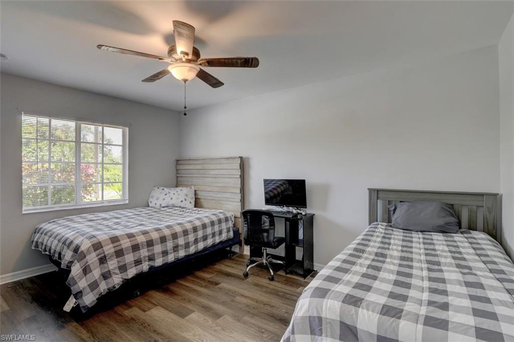 2812 4th Street Southwest Lehigh Acres, FL 33976 - Photo 24 of 34 a bedroom with a bed and a window