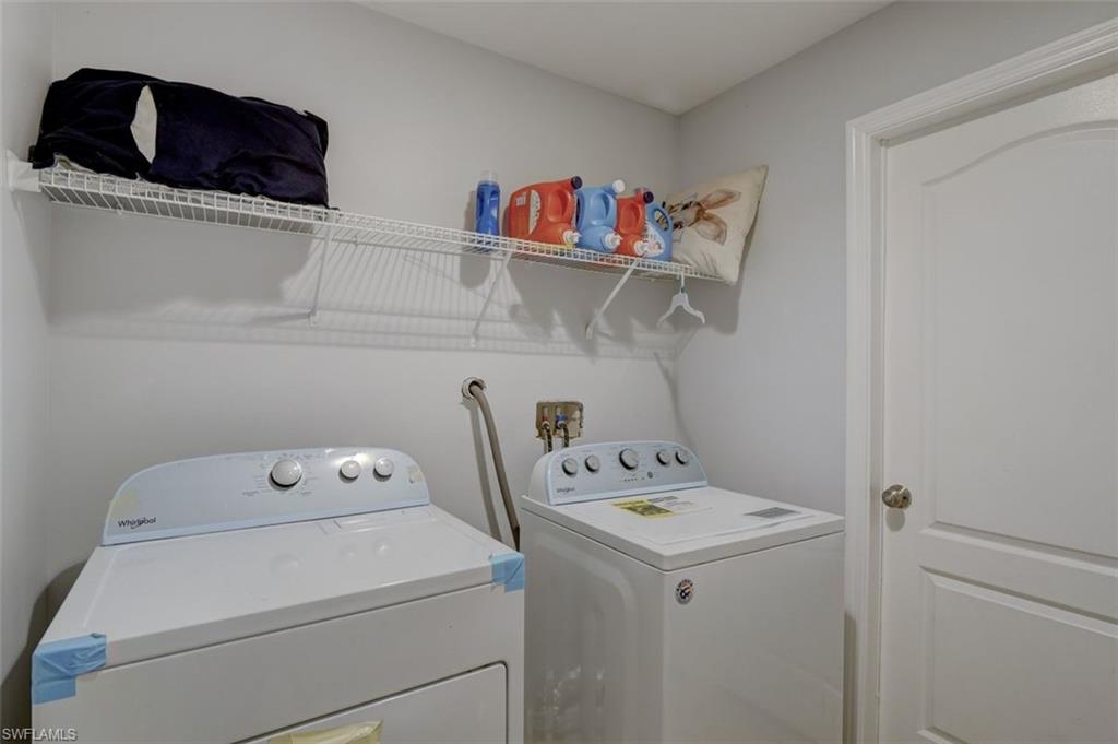 2812 4th Street Southwest Lehigh Acres, FL 33976 - Photo 31 of 34 a utility room with dryer and washer