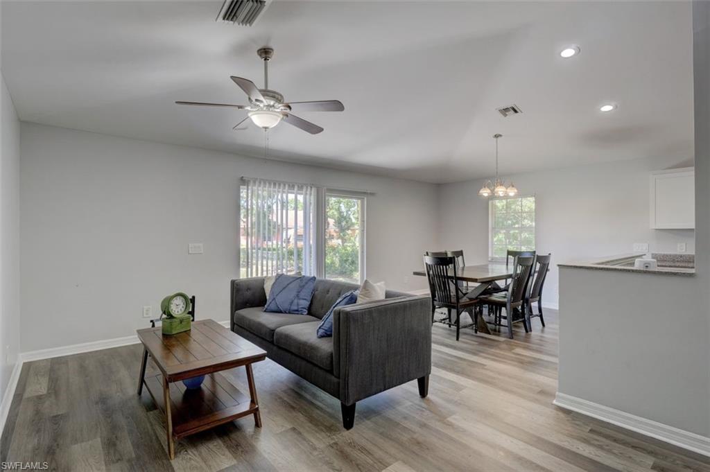 2812 4th Street Southwest Lehigh Acres, FL 33976 - Photo 6 of 34 a living room with furniture and a window
