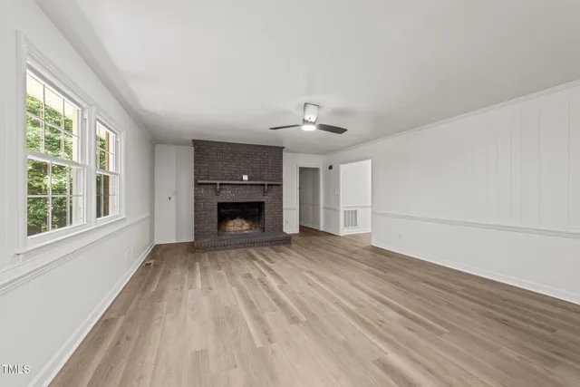 a kitchen with a sink a stove top oven and cabinets