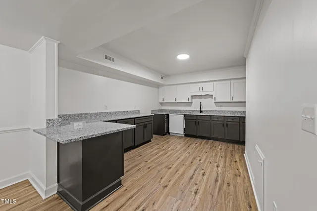 a white bath tub sitting next to a toilet