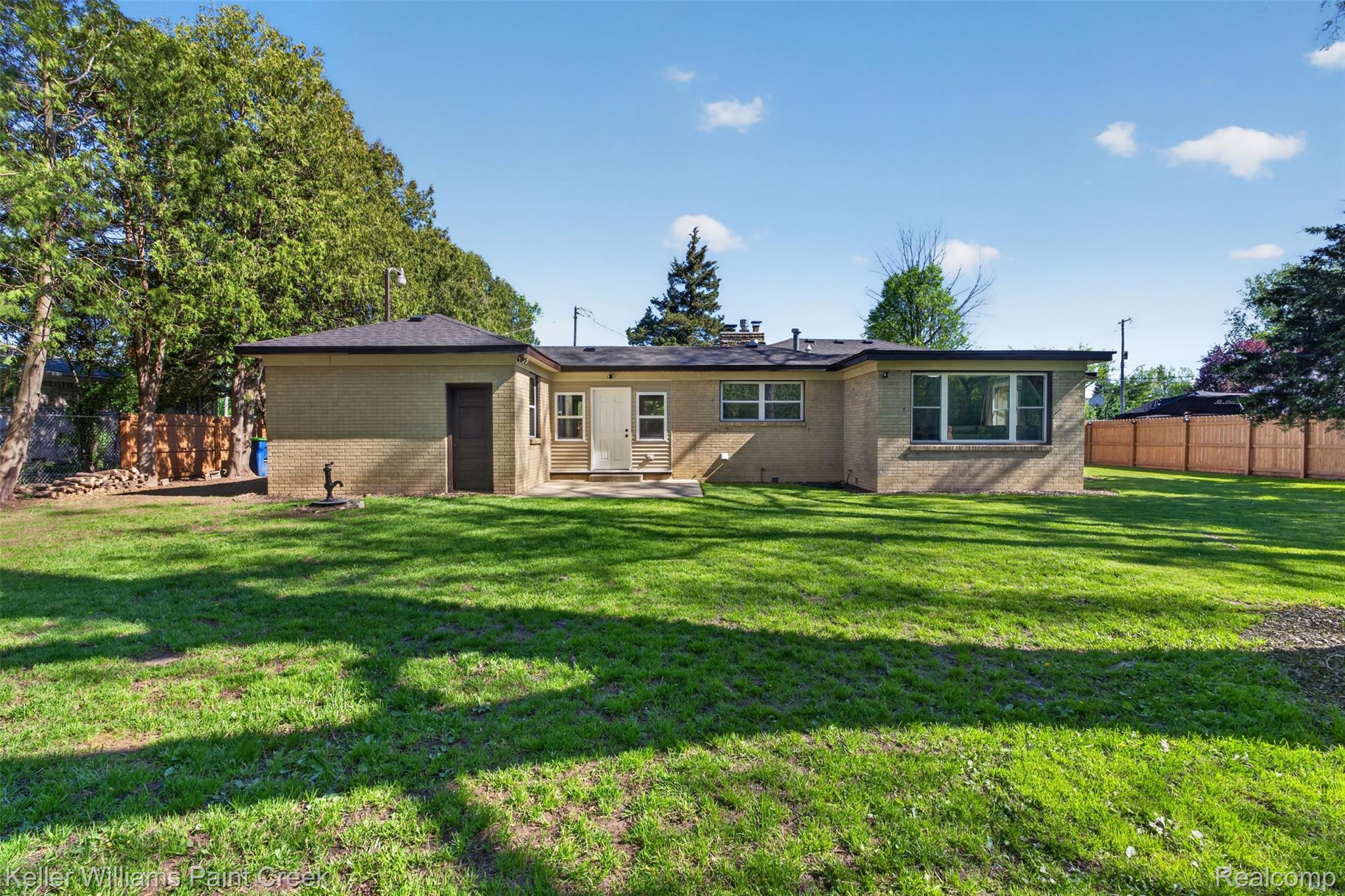 2942 Tatham Road Saginaw, MI 48601 - Photo 35 of 59 Back of property featuring brick siding and a patio area