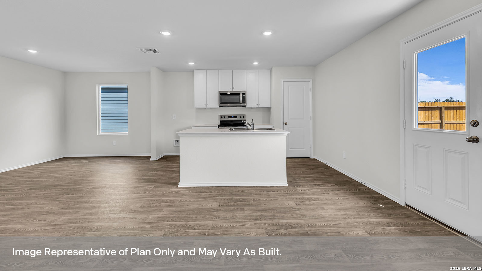 308 Windflower Cove Luling, TX 78648 - Photo 11 of 42 a kitchen with stainless steel appliances granite countertop a stove top oven a sink and a refrigerator
