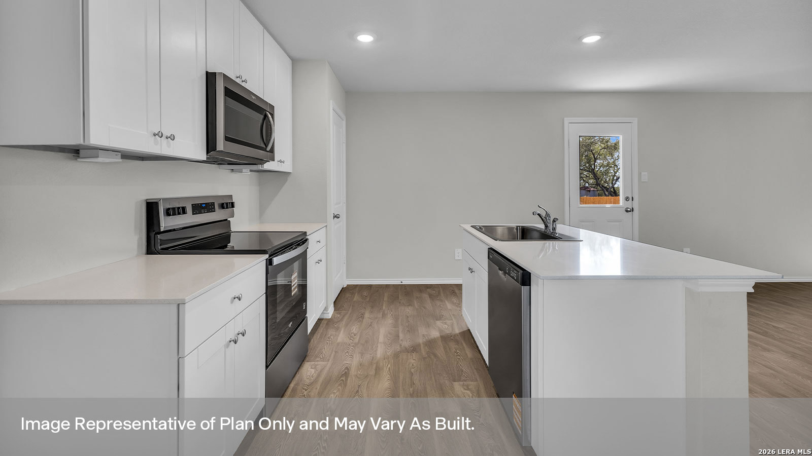 308 Windflower Cove Luling, TX 78648 - Photo 12 of 42 a kitchen with stainless steel appliances a white stove top oven a sink a refrigerator and white cabinets