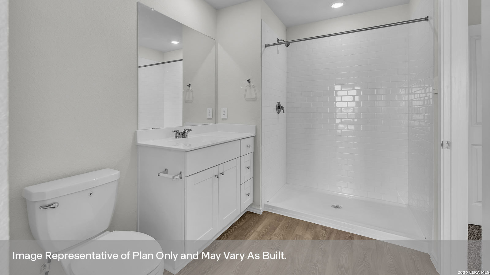 308 Windflower Cove Luling, TX 78648 - Photo 26 of 42 a bathroom with a shower a mirror and a sink