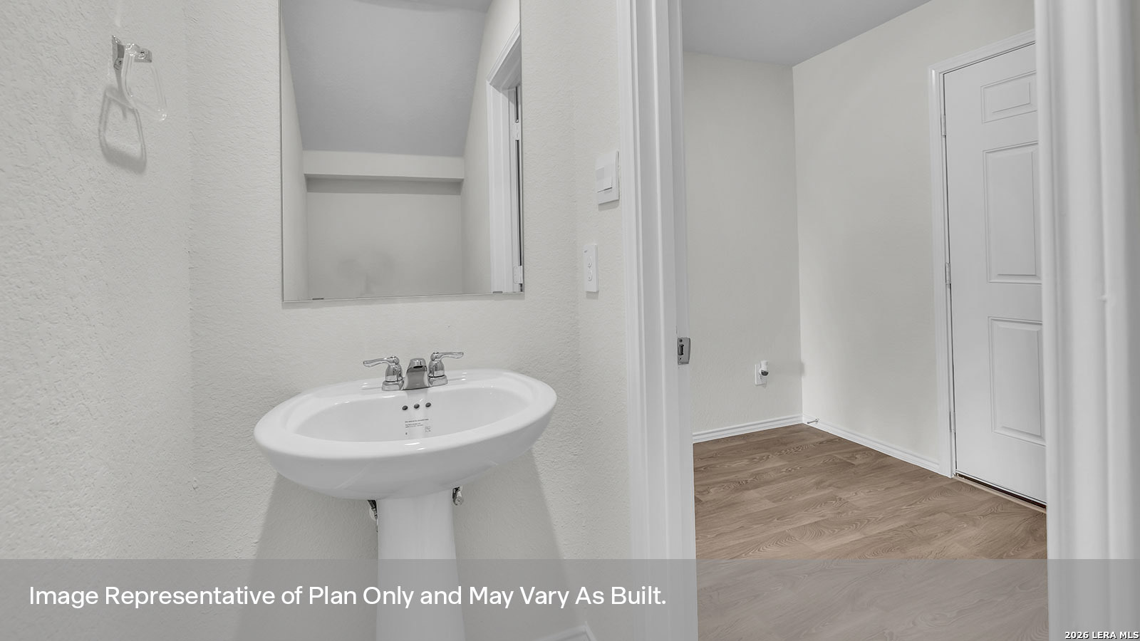 308 Windflower Cove Luling, TX 78648 - Photo 3 of 42 a bathroom with a sink and a mirror