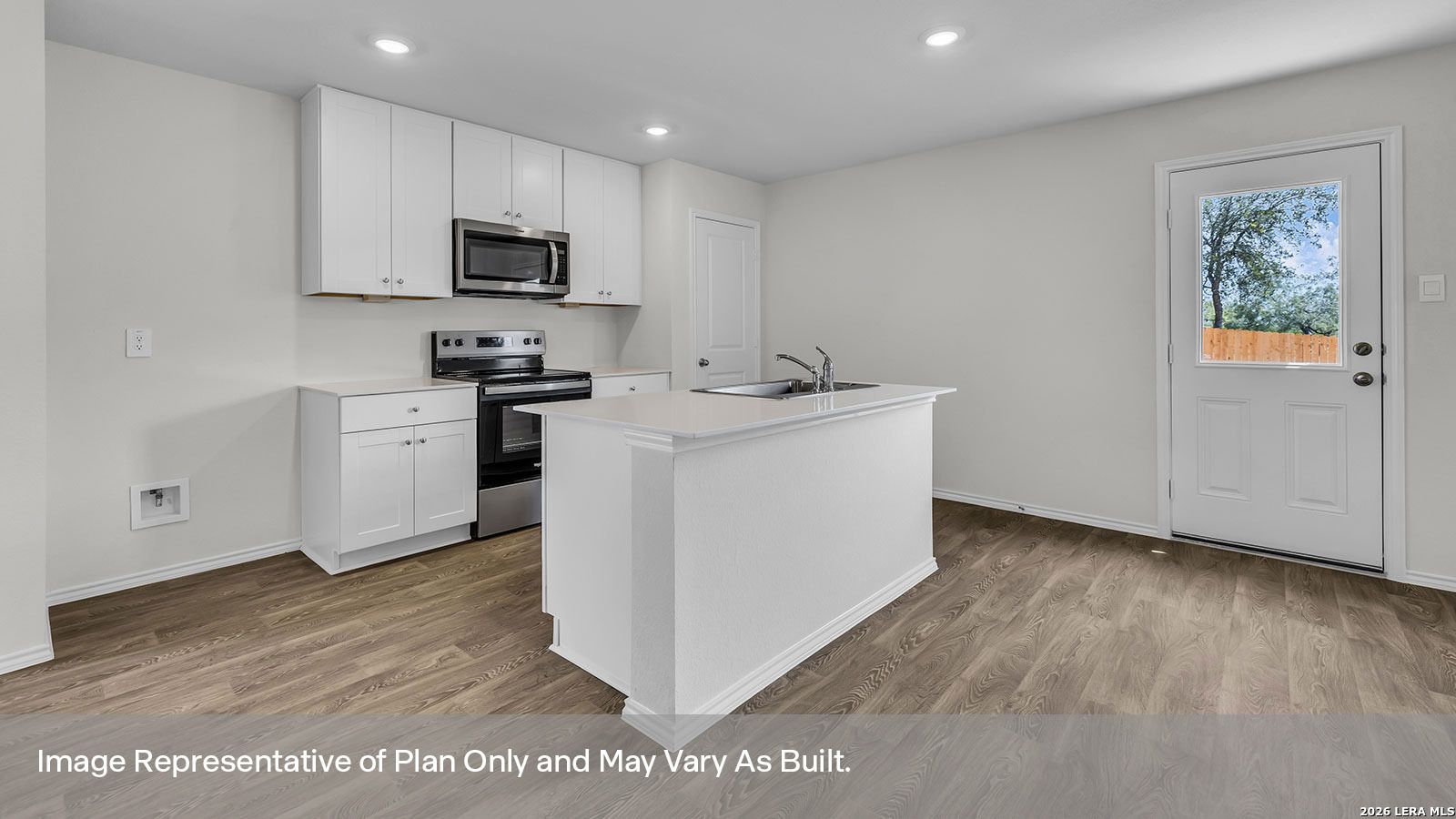 308 Windflower Cove Luling, TX 78648 - Photo 10 of 42 a kitchen with cabinets and wooden floor