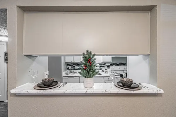 a kitchen that has a sink and a stove