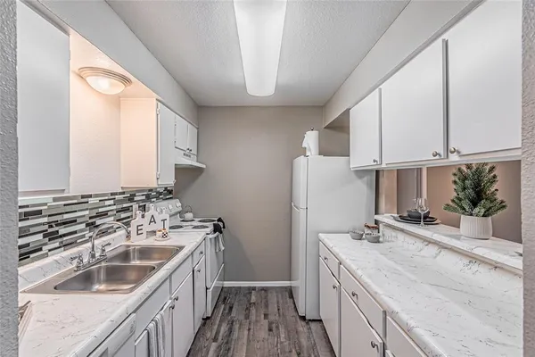 a kitchen with a sink and cabinets