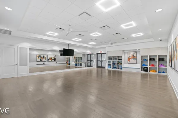 an aerial view of a house a yard and a patio