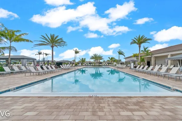 a view of a swimming pool and a yard