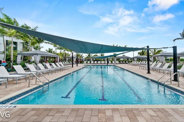 a view of swimming pool with outdoor seating