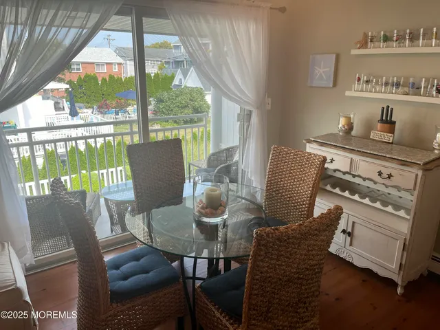 a living room with furniture a lamp and a chandelier