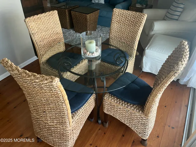 a kitchen with stainless steel appliances granite countertop a refrigerator a stove and white cabinets