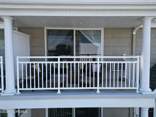 a black and white photo of a balcony