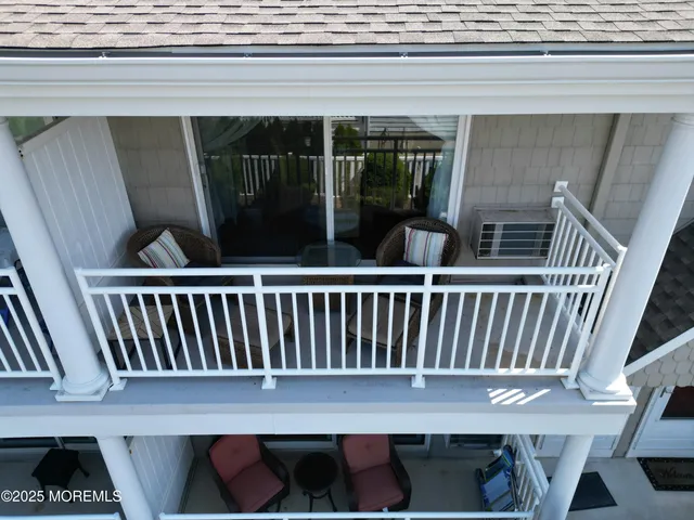 a living room with furniture and a mirror