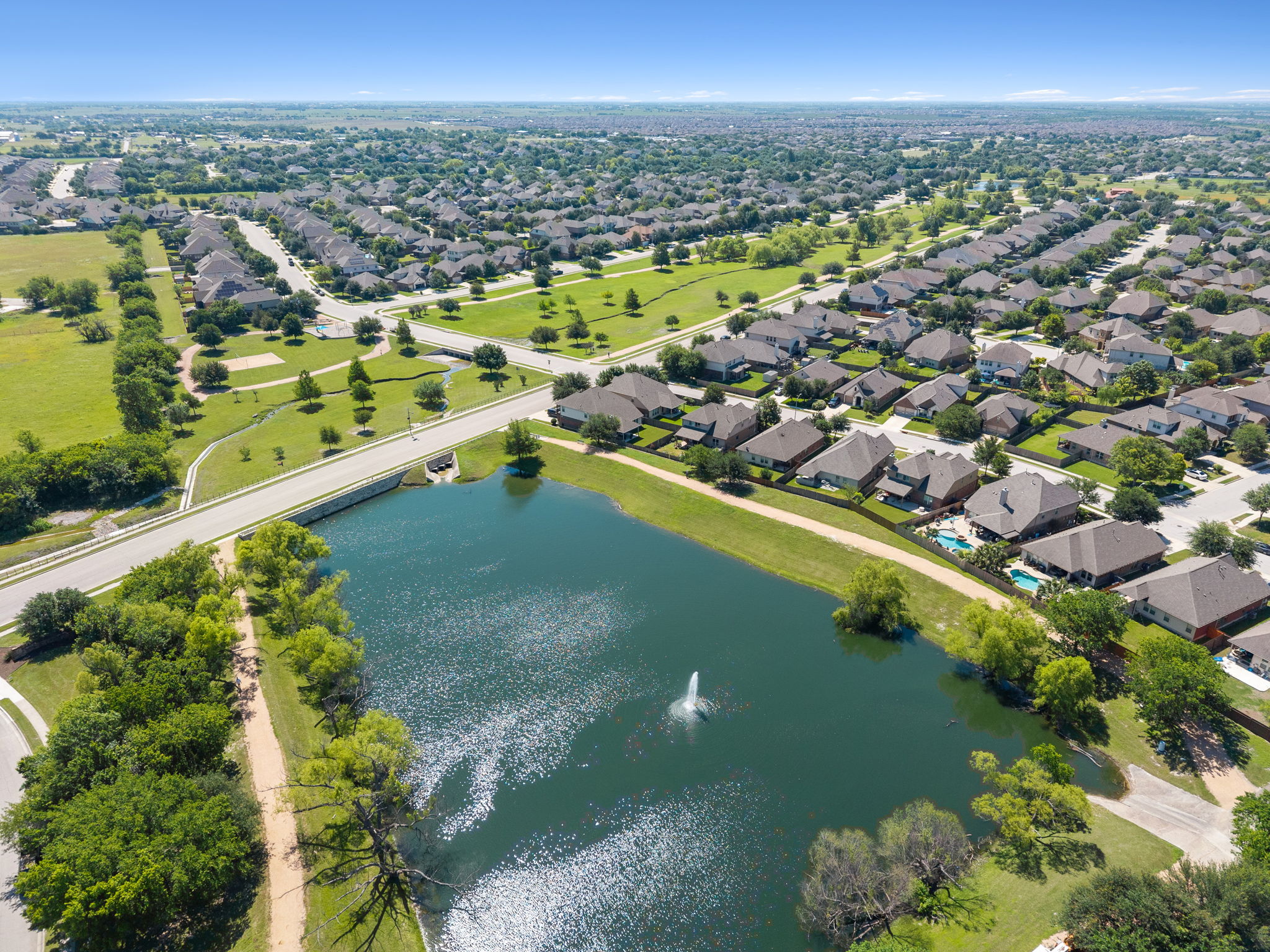 3101 Fresh Spring Road Pflugerville, TX 78660 - Photo 38 of 39 Aerial perspective showcasing a second pond at the other end of the greenway and trail system