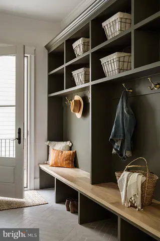 a bedroom with bed couch and window