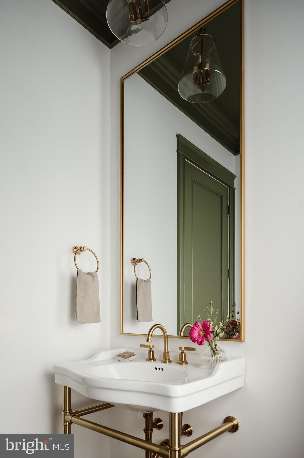 502 North Jackson Street Arlington, VA 22201 - Photo 15 of 21 a bathroom with a sink and a mirror