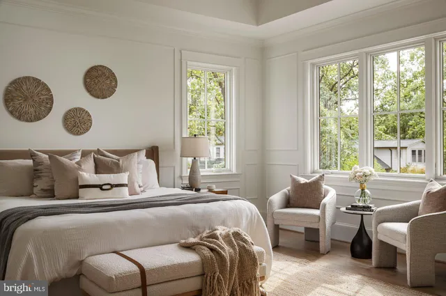 a bathroom with double sink and a mirror