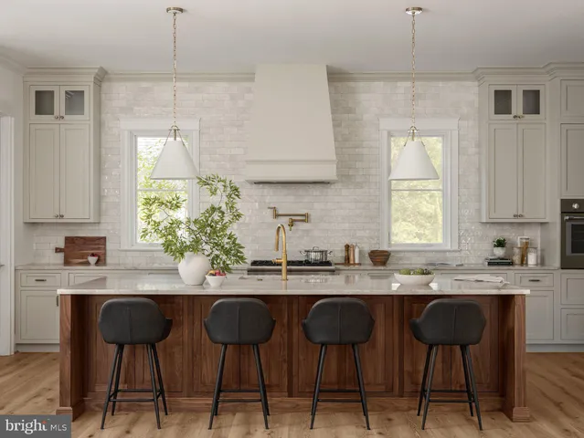 a kitchen with a table chairs stove and cabinets