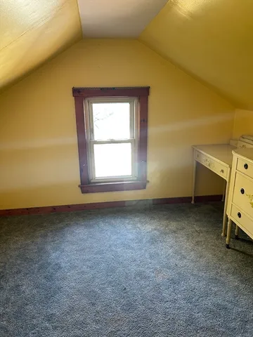 a view of a room with a dresser