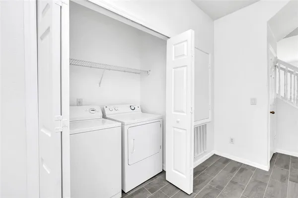 a utility room with dryer and washer