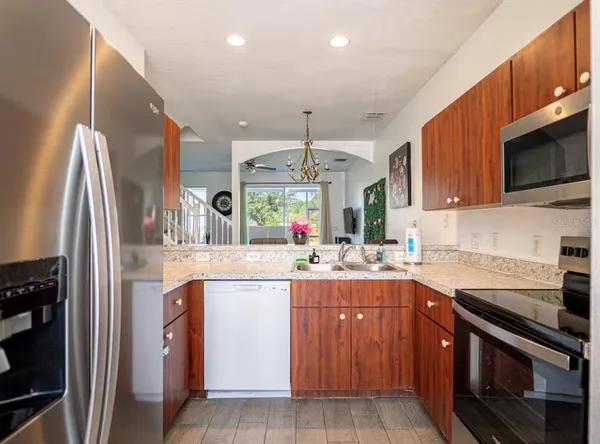 a kitchen with a sink stove and cabinets