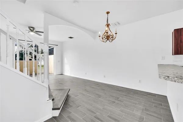 a view of a hallway with a chandelier