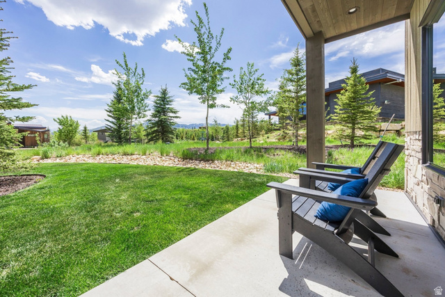 140 West Vista Road Kamas, UT 84036 - Photo 72 of 101 Covered patio with a concrete surface, stone exterior wall, and wood-finish ceiling
