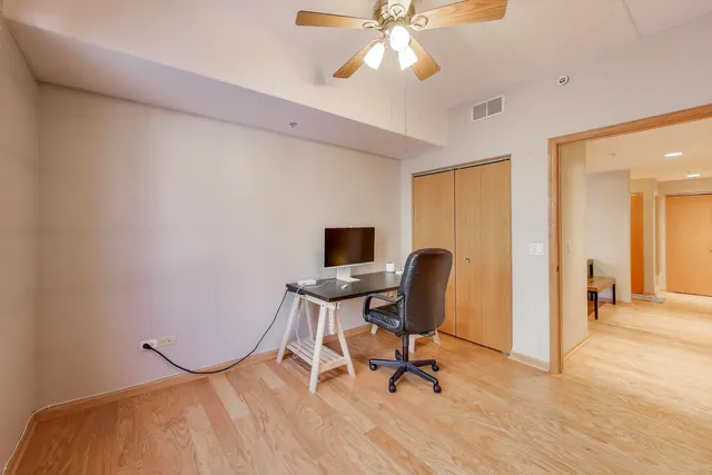 a bathroom with a sink a toilet a mirror and shower curtain