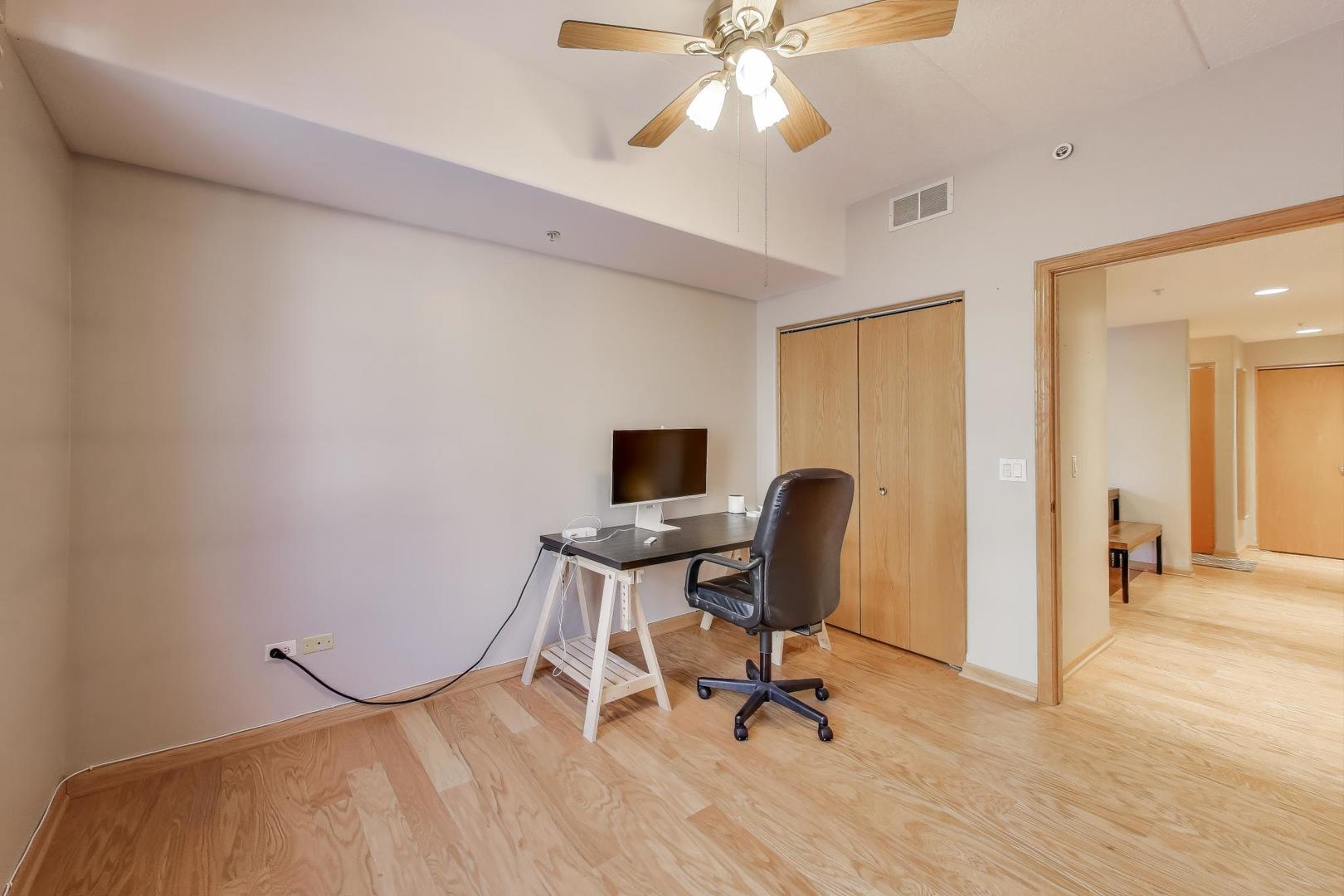 1715 Pavilion Way, Unit 206 Park Ridge, IL 60068 - Photo 14 of 19 a view of a workspace with furniture and a window