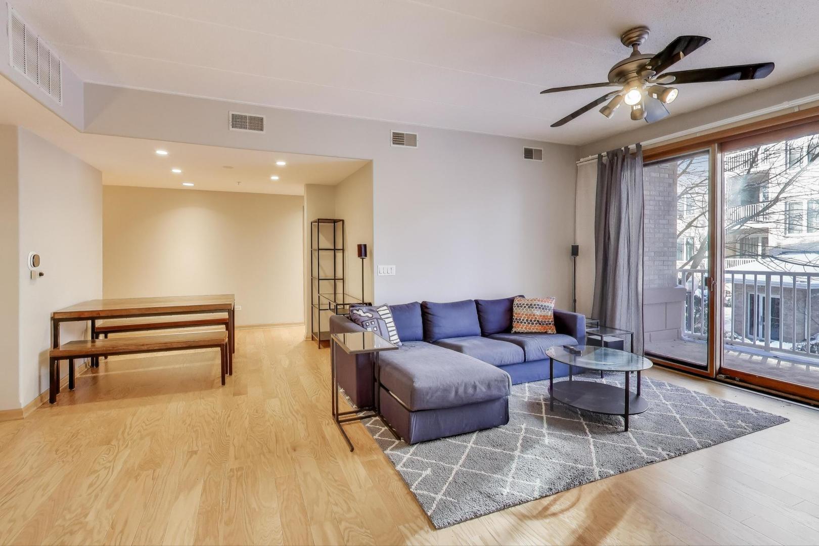1715 Pavilion Way, Unit 206 Park Ridge, IL 60068 - Photo 2 of 19 a living room with furniture and a piano