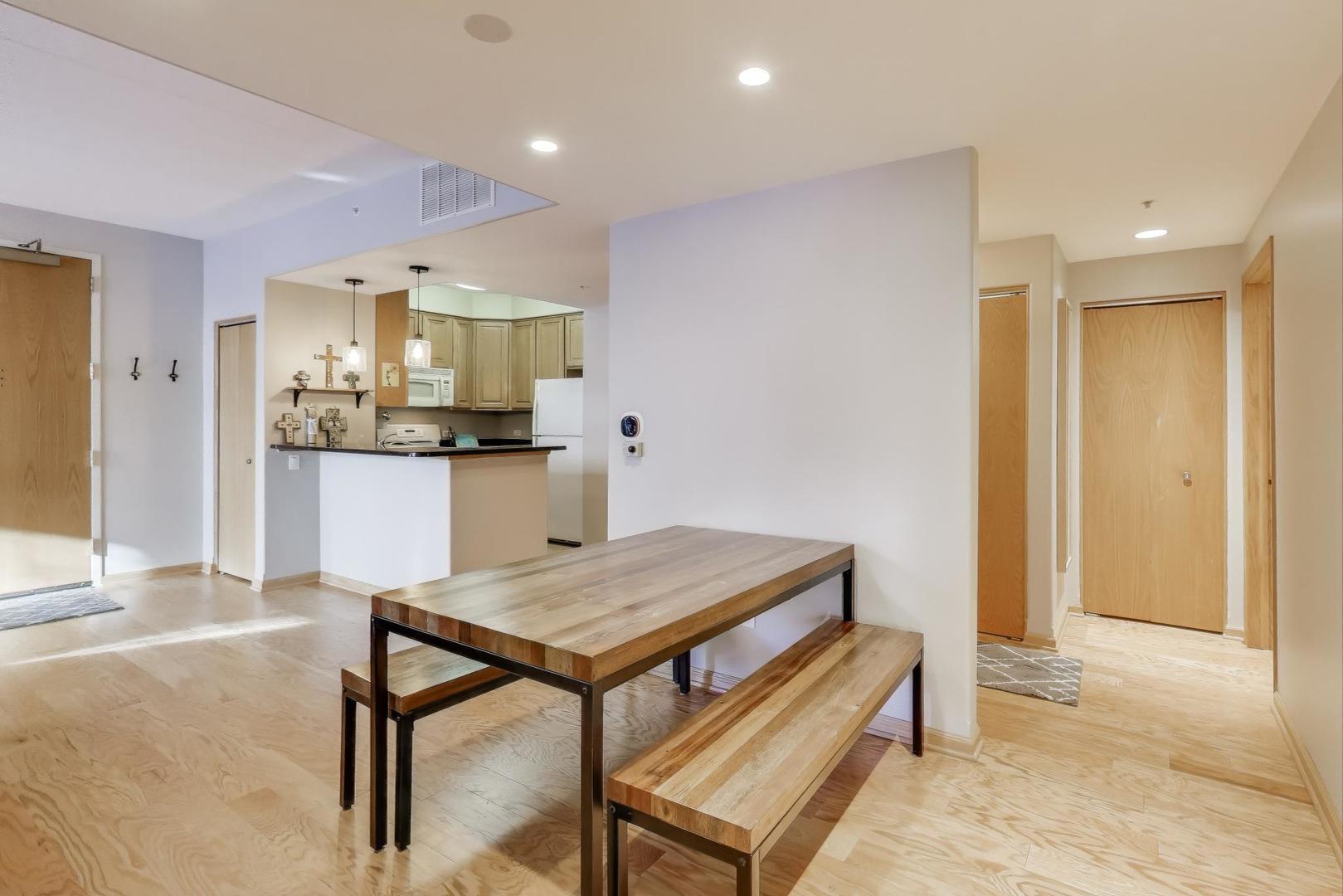 1715 Pavilion Way, Unit 206 Park Ridge, IL 60068 - Photo 6 of 19 a kitchen with a table and chairs in it