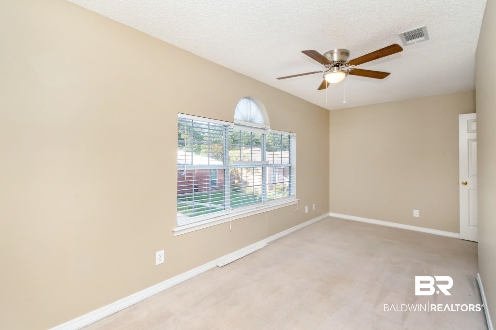 6482 Cedar Bend Court Mobile, AL 36608 - Photo 17 of 26 Unfurnished room featuring light carpet, a ceiling fan, and a textured ceiling