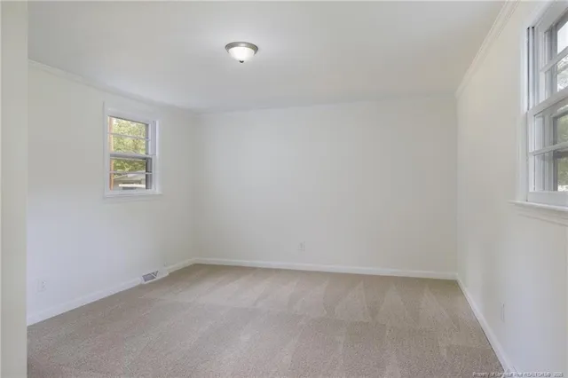 an empty room with windows