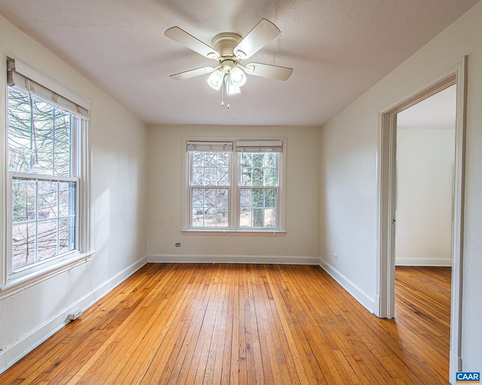 501 Valley Rd Extension Charlottesville, VA 22903 - Photo 13 of 23 wooden floor in an empty room with a window