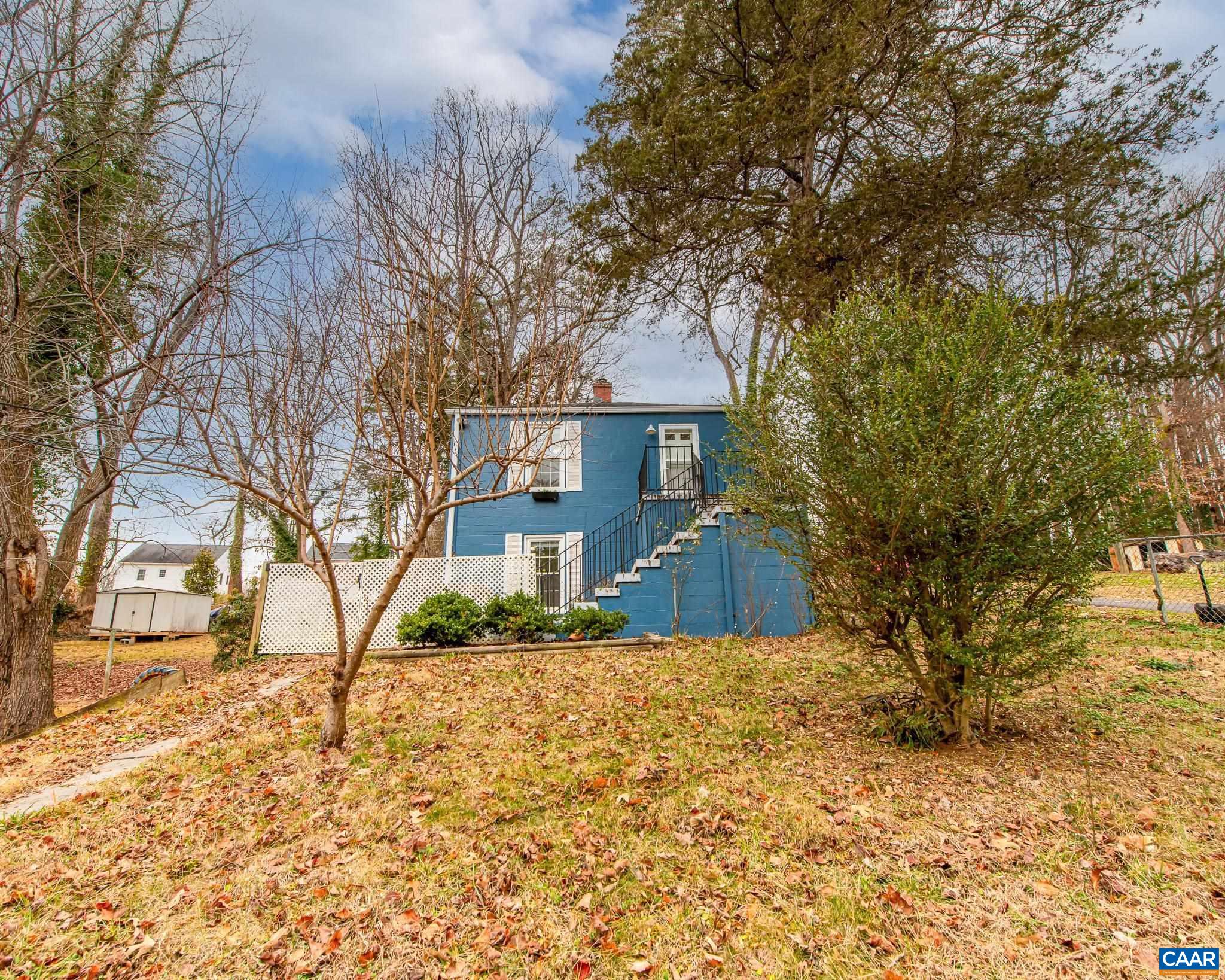 501 Valley Rd Extension Charlottesville, VA 22903 - Photo 21 of 23 a front view of a house with a yard
