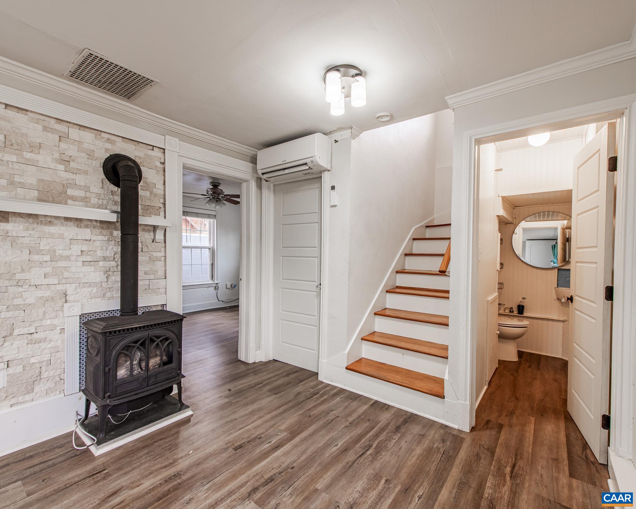 501 Valley Rd Extension Charlottesville, VA 22903 - Photo 5 of 23 a view of a livingroom with wooden floor and a fireplace