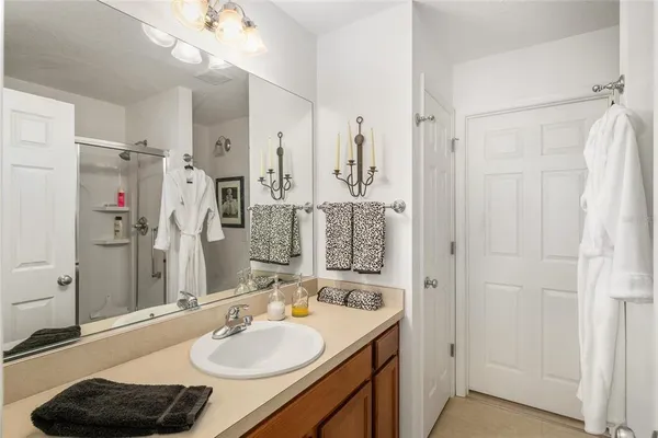 a bathroom with a sink double vanity and a mirror