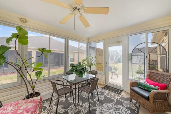 a living room filled with furniture and a large window
